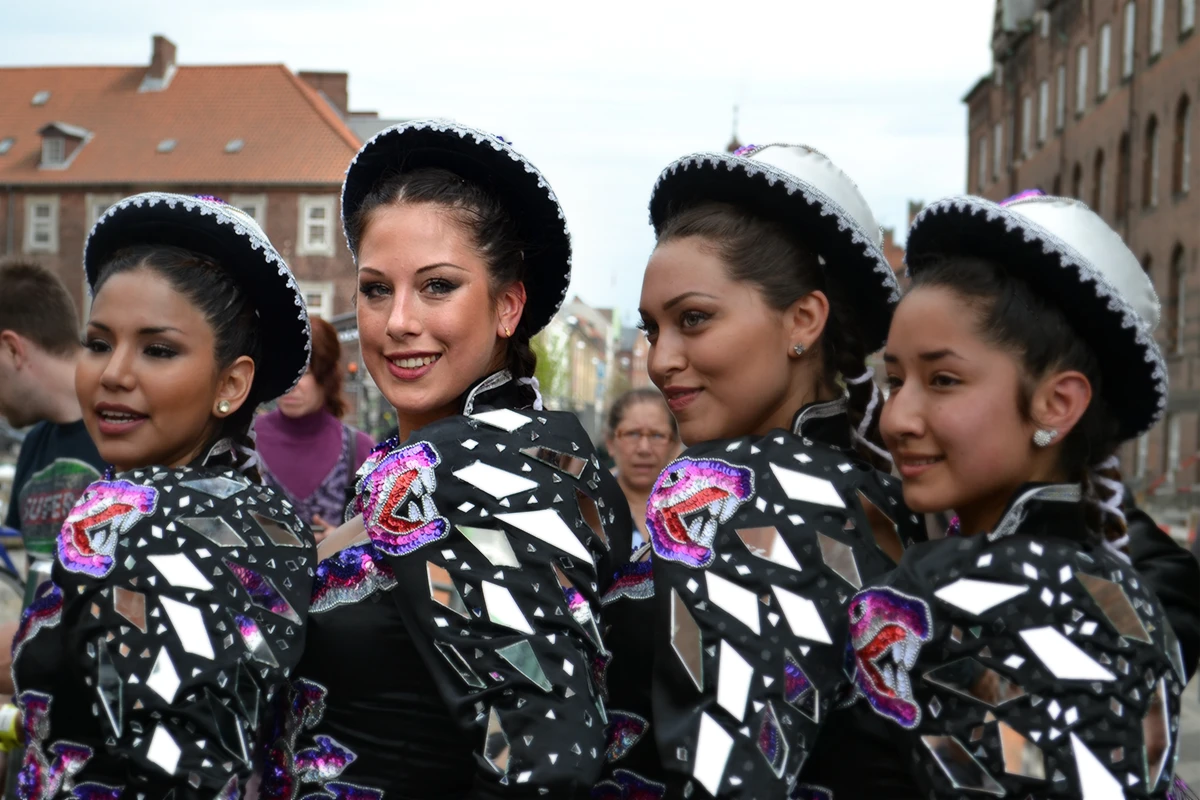 Beautiful young women posing for the cameras after finishing dancing at the Copenhagen Carnival Parade.