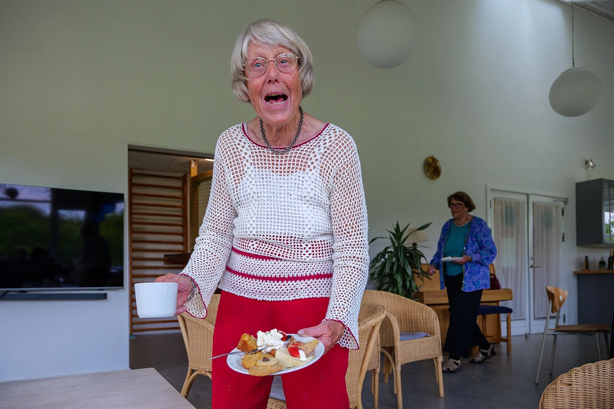 Lady enjoying dessert in a Christian Confirmation party.