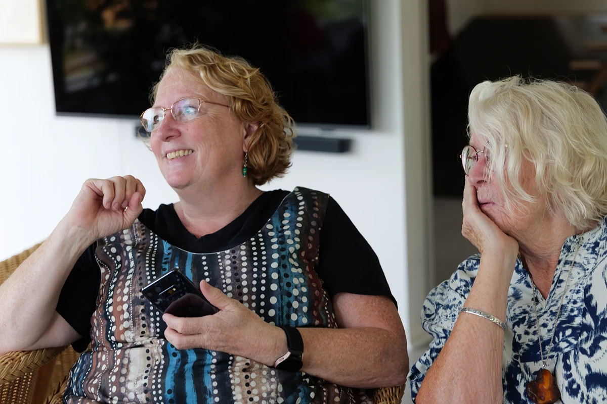 Aunt and grandmother smiling during confirmation party.”